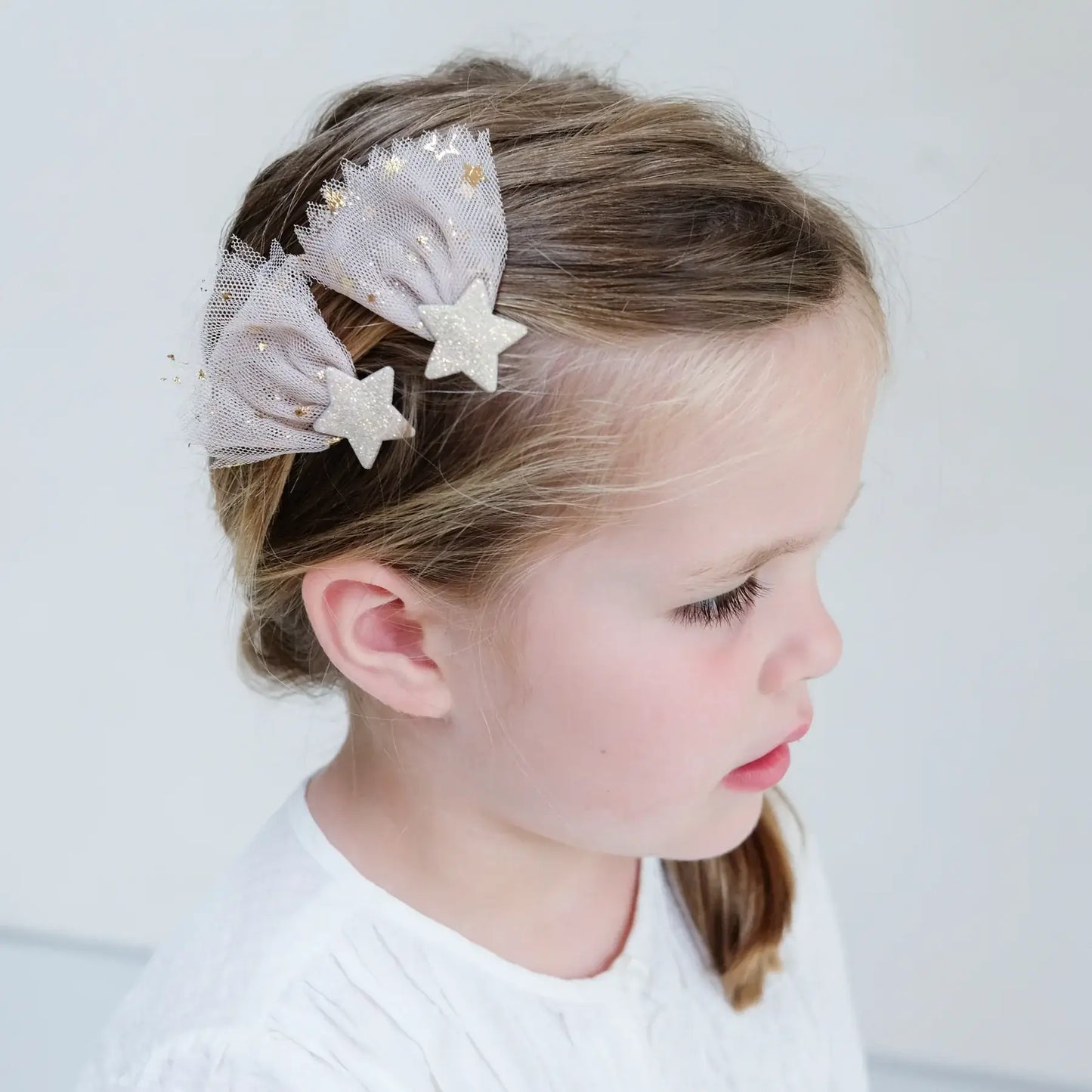 Delicate Mimi & Lula shooting star hair clips adorned with soft tulle and glitter, perfect for little ones.