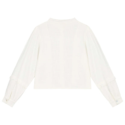 Back view of the Charlie Petite Charmaine Blouse in white, featuring long sleeves and ruffles for girls.