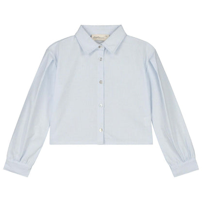 Light blue Charlie Petite Gaby blouse with long sleeves and button closure for girls, featuring a stylish cropped design.