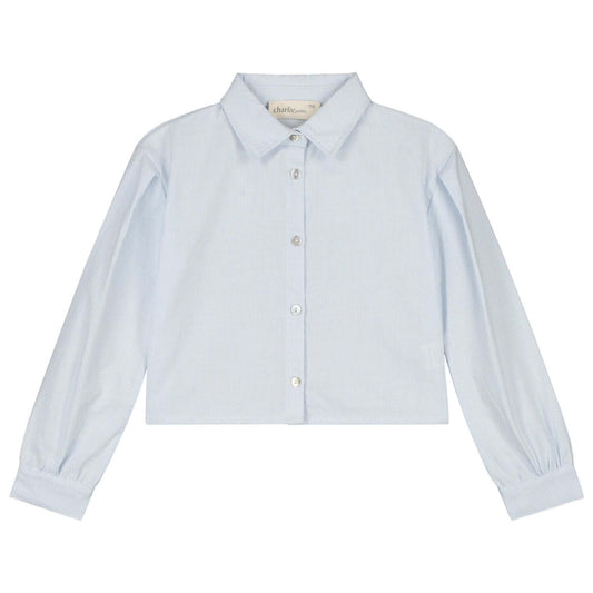 Light blue Charlie Petite Gaby blouse with long sleeves and button closure for girls, featuring a stylish cropped design.