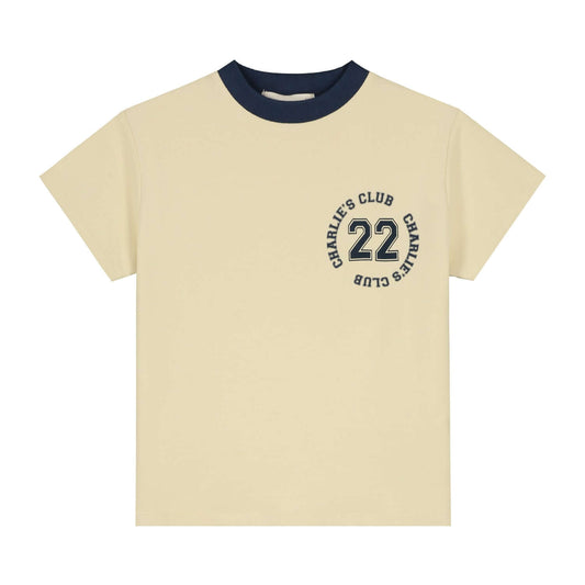 Charlie Petite Luc T-Shirt in cream with indigo collar and circular logo, perfect for casual style.