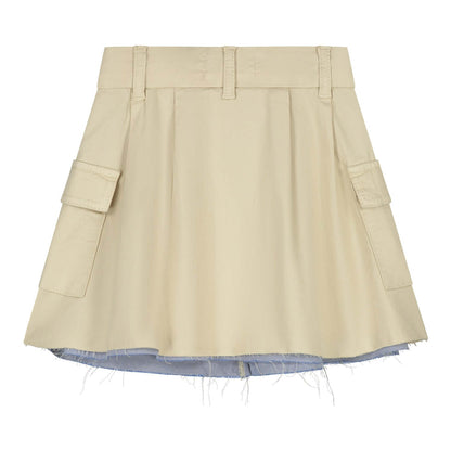 Charlie Petite Lucie Rok sand, a light skirt for girls featuring side pockets and a stylish design.